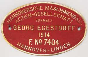 Egestorff 7404, 1914, Messingguss, Riffelgrund mit Rand. Schild von DRG 55 3111, ex KED Altona "4841"