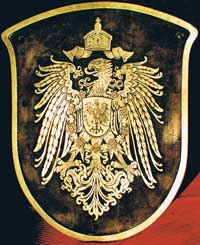 Eigentumsschild Deutsches Kaiserreich, Messingguss, wappenfrmig. BxH = 500 x 460 mm. Verwendung an den Lokomotiven bei O&K in Togo.