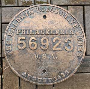 Fabrikschild Baldwin Locomotive Works, Philadelphia, U.S.A. Fabriknummer: 56923, Baujahr: 1923. Bronzeguss rund, glatt mit Rand. D = 235 mm. Das Fabrikschild ist von einer Dampflok aus Brasilien, São Paulo (VFCO 435).