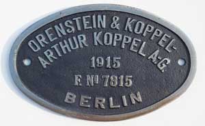 Fabrikschild Orenstein & Koppel, Arthur Koppel A.-G., Berlin. Fabriknummer: 7815, Baujahr: 1915, Eisenguss, oval, Riffelgrund mit Rand. Das Schild ist von der DRB 56 603, ex. DRG 55 3251, ex. KPEV.