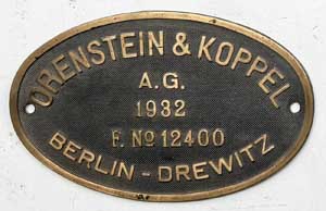 Fabrikschild Orenstein&Koppel, Berlin-Drewitz, Fabriknummer: 12400, Baujahr: 1932. Messingguss oval, Riffelgrund mit Rand. B x H =&nbsp;215 x 135 mm. Das Schild ist von der DRG 99 321.