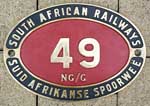 South African Railways, SAR, NG/G, Messingguss mit Rand. Das Schild ist von einer Garratt-Schmalspurlok